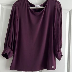 New blouse with sheer 3/4” sleeves.